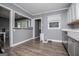 Bright kitchen area featuring gray walls, ample cabinetry, and modern appliances at 6391 Katherine St, Douglasville, GA 30134