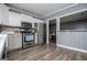 Well-equipped kitchen with stainless steel appliances and adjacent dining area at 6391 Katherine St, Douglasville, GA 30134