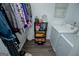 Well-organized laundry area with shelving, washer, dryer, and ample storage space at 6391 Katherine St, Douglasville, GA 30134
