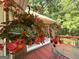 Charming back deck with flowering plants, perfect for outdoor relaxation at 280 Emerald Lake Dr, Fayetteville, GA 30215