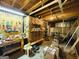Unfinished basement workshop with exposed beams, tools, and ample storage space for DIY projects at 280 Emerald Lake Dr, Fayetteville, GA 30215