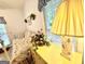 Bright bedroom featuring a white metal daybed, a charming window, and a lamp atop a pale yellow dresser at 280 Emerald Lake Dr, Fayetteville, GA 30215