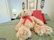 Cozy bedroom featuring a plush green bed adorned with a teddy bear and red pillows at 280 Emerald Lake Dr, Fayetteville, GA 30215