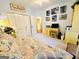 Cozy bedroom with white metal bed frame, matching desk, and unique city pictures adorning the blue wall at 280 Emerald Lake Dr, Fayetteville, GA 30215