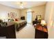 Traditional bedroom with a plush bed, dark wood furniture, and a window with decorative curtains at 280 Emerald Lake Dr, Fayetteville, GA 30215