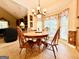 Bright breakfast nook features a wood table, chair set, and large windows for natural light at 280 Emerald Lake Dr, Fayetteville, GA 30215