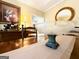 Dining room table with decorative bowl and a view to other living spaces at 280 Emerald Lake Dr, Fayetteville, GA 30215