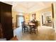 Elegant dining room with chandelier, neutral walls, and plush carpeting at 280 Emerald Lake Dr, Fayetteville, GA 30215