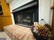 Fireplace with brick surround and decorative accents at 280 Emerald Lake Dr, Fayetteville, GA 30215