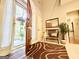 Inviting foyer featuring tile floors, bench, and a view to the outdoor landscape at 280 Emerald Lake Dr, Fayetteville, GA 30215