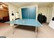 Recreational area with a ping pong table and paddles, perfect for game nights and indoor fun at 280 Emerald Lake Dr, Fayetteville, GA 30215