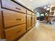 Close-up of kitchen cabinetry with woodgrain finish and dark hardware at 280 Emerald Lake Dr, Fayetteville, GA 30215