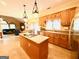 Open kitchen and island with views to the eat in breakfast area and living room at 280 Emerald Lake Dr, Fayetteville, GA 30215