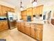 Spacious kitchen with wooden cabinets, stainless steel appliances, and center island at 280 Emerald Lake Dr, Fayetteville, GA 30215