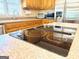 Kitchen with smooth cooktop on the island and stainless steel appliances at 280 Emerald Lake Dr, Fayetteville, GA 30215