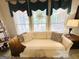 Comfortable living room with sofa and large bright windows at 280 Emerald Lake Dr, Fayetteville, GA 30215