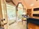Living room with french doors leading to a screened porch and lots of natural light at 280 Emerald Lake Dr, Fayetteville, GA 30215