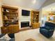 Living room with fireplace, built-in bookcases, and comfortable seating at 280 Emerald Lake Dr, Fayetteville, GA 30215