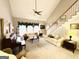 Spacious living room with grand piano, sofas and staircase at 280 Emerald Lake Dr, Fayetteville, GA 30215