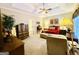 Bright bedroom boasts neutral walls, a tray ceiling, and a cozy ambiance at 280 Emerald Lake Dr, Fayetteville, GA 30215