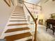 Elegant staircase with wooden banister and hardwood steps at 280 Emerald Lake Dr, Fayetteville, GA 30215