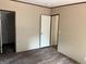 Bedroom featuring dark floors, a wardrobe, and neutral colored walls at 436 Laurel Trce, Carrollton, GA 30116
