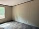 Bedroom with a window letting in natural light, complemented by neutral walls at 436 Laurel Trce, Carrollton, GA 30116
