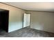 Bedroom featuring neutral paint, luxury vinyl flooring, and access to a bathroom at 436 Laurel Trce, Carrollton, GA 30116
