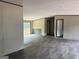 Open living space showcasing luxury vinyl floors, neutral wall color, and sliding glass door to the exterior at 436 Laurel Trce, Carrollton, GA 30116