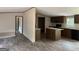 Open-concept home, showcasing luxury vinyl flooring, abundant natural light, and views into the modern kitchen at 436 Laurel Trce, Carrollton, GA 30116