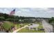 An aerial view of Austell, Georgia's Veterans Memorial with an American flag and monuments at 5880 Mulberry St, Austell, GA 30168