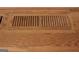 Close-up of a hardwood floor, showing an air vent with a classic design and wood grain at 5880 Mulberry St, Austell, GA 30168