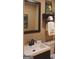 Updated bathroom with a modern vanity, framed mirror, and bath accessories at 5880 Mulberry St, Austell, GA 30168