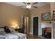 Comfortable bedroom featuring a ceiling fan, complemented by a cozy teddy bear on the bed at 5880 Mulberry St, Austell, GA 30168