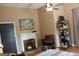 Bedroom with a white fireplace, bookshelf with books, and a window with lots of natural light at 5880 Mulberry St, Austell, GA 30168