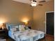Comfortable bedroom with a plush bed, soft lighting, and dark door, creating a relaxing retreat at 5880 Mulberry St, Austell, GA 30168