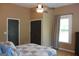 Bright bedroom featuring two closets, providing ample storage space, complemented by neutral decor at 5880 Mulberry St, Austell, GA 30168