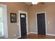 Neutral bedroom features hardwood floors, neutral paint, and natural light at 5880 Mulberry St, Austell, GA 30168