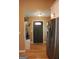 Entryway featuring hardwood floors and stainless refrigerator, providing a welcoming and functional space at 5880 Mulberry St, Austell, GA 30168