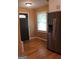 Entryway featuring hardwood floors and stainless refrigerator, providing a welcoming and functional space at 5880 Mulberry St, Austell, GA 30168