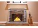 Cozy fireplace adorned with decorative candles and accent brooms, creating a warm focal point at 5880 Mulberry St, Austell, GA 30168