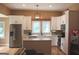 Bright kitchen with white cabinets and stainless appliances, creating a modern and efficient workspace at 5880 Mulberry St, Austell, GA 30168