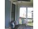 Screened patio with comfortable seating, perfect for outdoor relaxation at 5880 Mulberry St, Austell, GA 30168