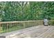 Spacious deck surrounded by lush greenery, perfect for outdoor entertaining with a stainless steel grill at 110 Heatherwood Dr, Fayetteville, GA 30215