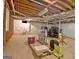 Unfinished basement offering potential with exposed ceiling and walls, and concrete floors for personalization at 110 Heatherwood Dr, Fayetteville, GA 30215