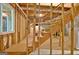 Unfinished basement with wooden framing, offering a blank canvas for customization and expansion at 110 Heatherwood Dr, Fayetteville, GA 30215