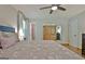 Primary bedroom featuring hardwood floors, closet, and ensuite bathroom at 110 Heatherwood Dr, Fayetteville, GA 30215