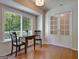 Bright breakfast nook with a window overlooking a deck, with wood flooring and white trim at 110 Heatherwood Dr, Fayetteville, GA 30215