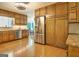 Well-lit kitchen with stainless steel appliances, wood cabinets, and a view to the dining area at 110 Heatherwood Dr, Fayetteville, GA 30215