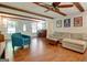 Comfortable living room with wood floors, exposed beams, and neutral decor at 110 Heatherwood Dr, Fayetteville, GA 30215